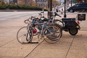 several bikes are in the bicycle parking lot