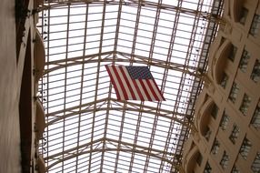 american flag under glass roof