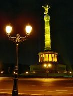 column monument in berlin at night