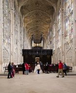 tourists in king's college chapel, uk, england, cambridge
