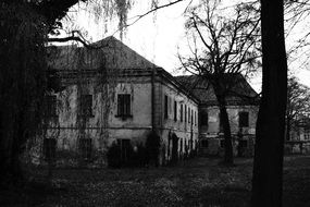 Abandoned shabby house in black and white