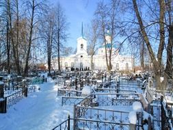 cemetery on the background of the white church in Russia