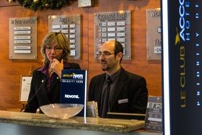 Hotel receptionists at desk