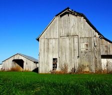 wooden barn buildings at farm