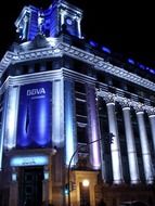 house with columns in night illumination in the port city of Bilbao