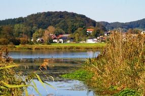village near the lake at the foot of the mountain