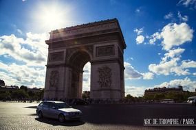 Triumphal arch in Paris in the rays of the sun