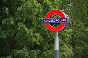 metro station sign at green trees, uk, england, london