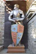 medieval armor and shield with coat of arms in mont saint michel castle, france