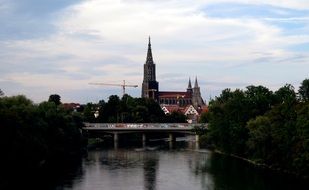 bridge across danube river in front of ulm cathedral, germany, munich