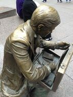 bronze statue of man with case, september 11 memorial, usa, nyc