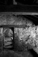 aged stone doorway in ruins at night