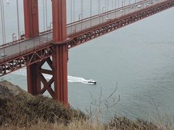 boat under the Golden Gate Bridge