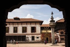 statue with bell on square in ancient Newa city, nepal, bhaktapur