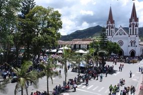 people on square at Minor Basilica of Our Lady of Carmen, colombia, Antioquia