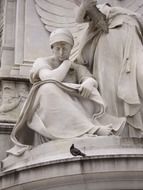 stone statue of buckingham palace,gazing at pigeon, uk, england, london