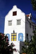 anciently designed white house with a garden