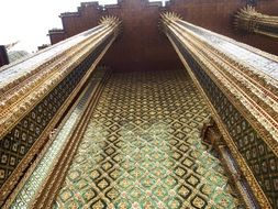 golden pillars in an ancient temple in asia