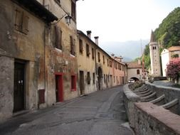 old constructed houses along a tiny road