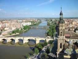 Basilica of Our Lady of the Pillar and the Puente de Piedra bridge in city skyline, spain, zaragosa