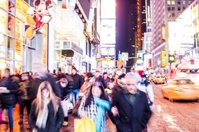 flow of people on time square at night