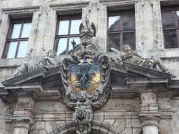 Stone town hall building with coat of arms of Nuremberg