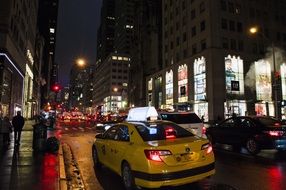 yellow taxi at night in Manhattan