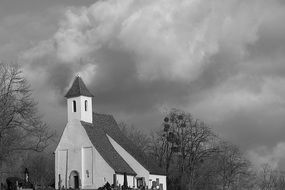 old chapel at cloudy sky, black and white