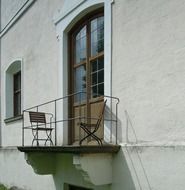 balcony near the window on the facade of the building