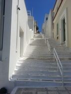 staircase among white houses in greece