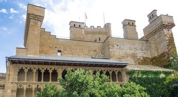 medieval castle with arches on the facade