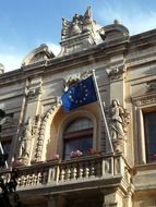 EU flag on the balcony of a historic building