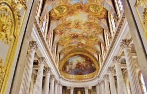 white and gold interior of versailles, paris, france