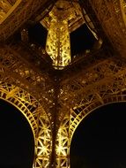eiffel tower with yellow lights at night