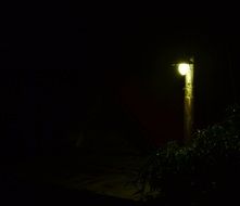 street lamp on the house in the dark