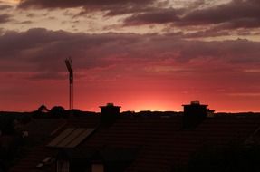 crane silhouette on the red sky