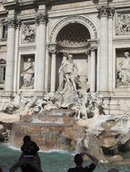 sculpture with a fountain near a building in rome