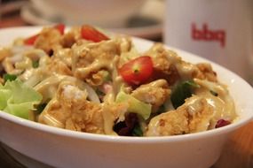 Asian dinner with tomato, mayonnaise, fried chicken