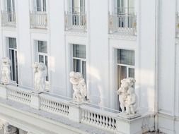 balcony with figures on the hotel building