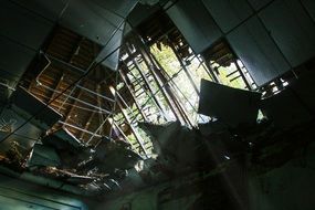 bottom view of the broken roof of an abandoned building