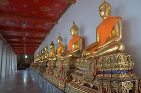 golden Ancient buddha statues in a temple