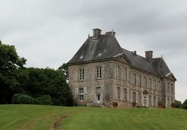 medieval manor on a green lawn