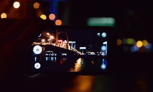 Making a photo by mobile of night city