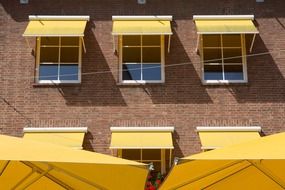 protective umbrellas on the windows in the summer