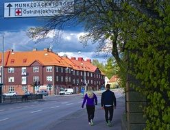 couple walking on the sidewalk