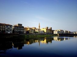 landscape of city buildings by the river in Italy