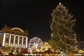 Christmas tree on the background of the Christmas market in Dresden