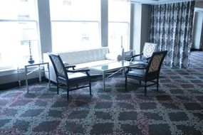 table with chairs in a room near the window
