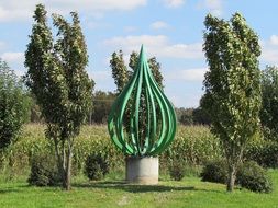 Green sculpture in park
