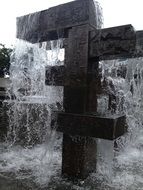 black and white photo of a city fountain